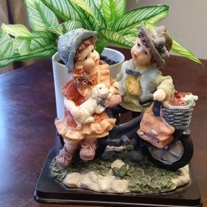 2 children on a bike